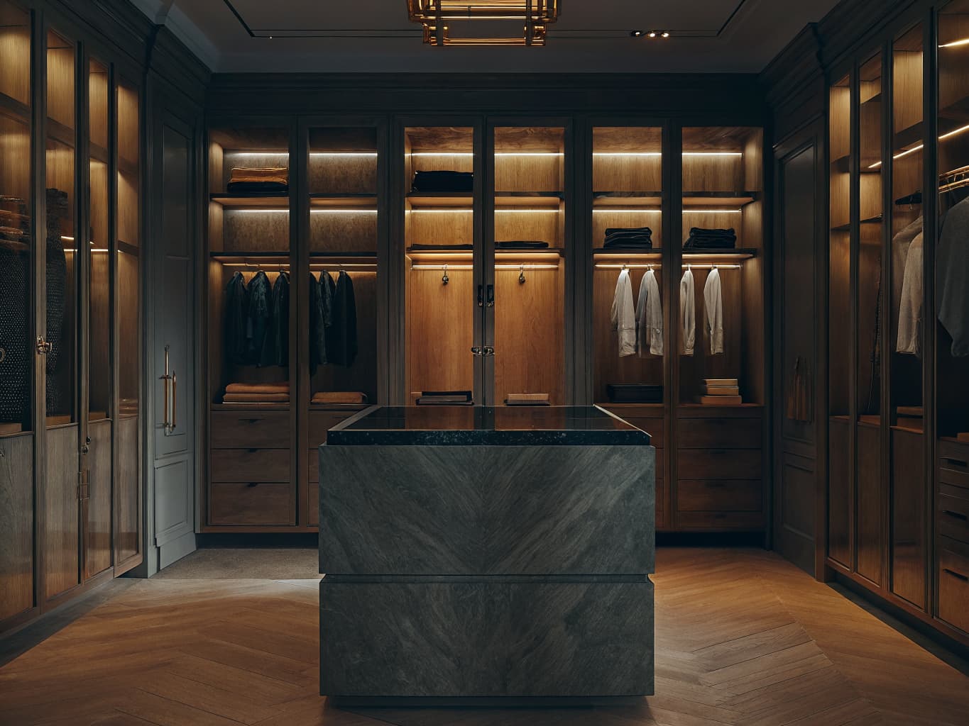 Luxury walk-in closet with custom wood cabinetry and island