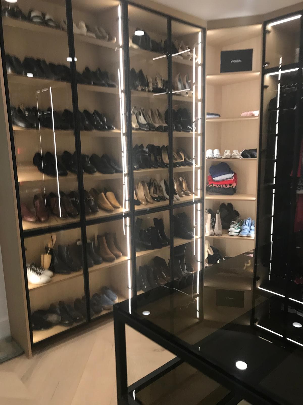 Custom shoe display closet with glass front cabinets