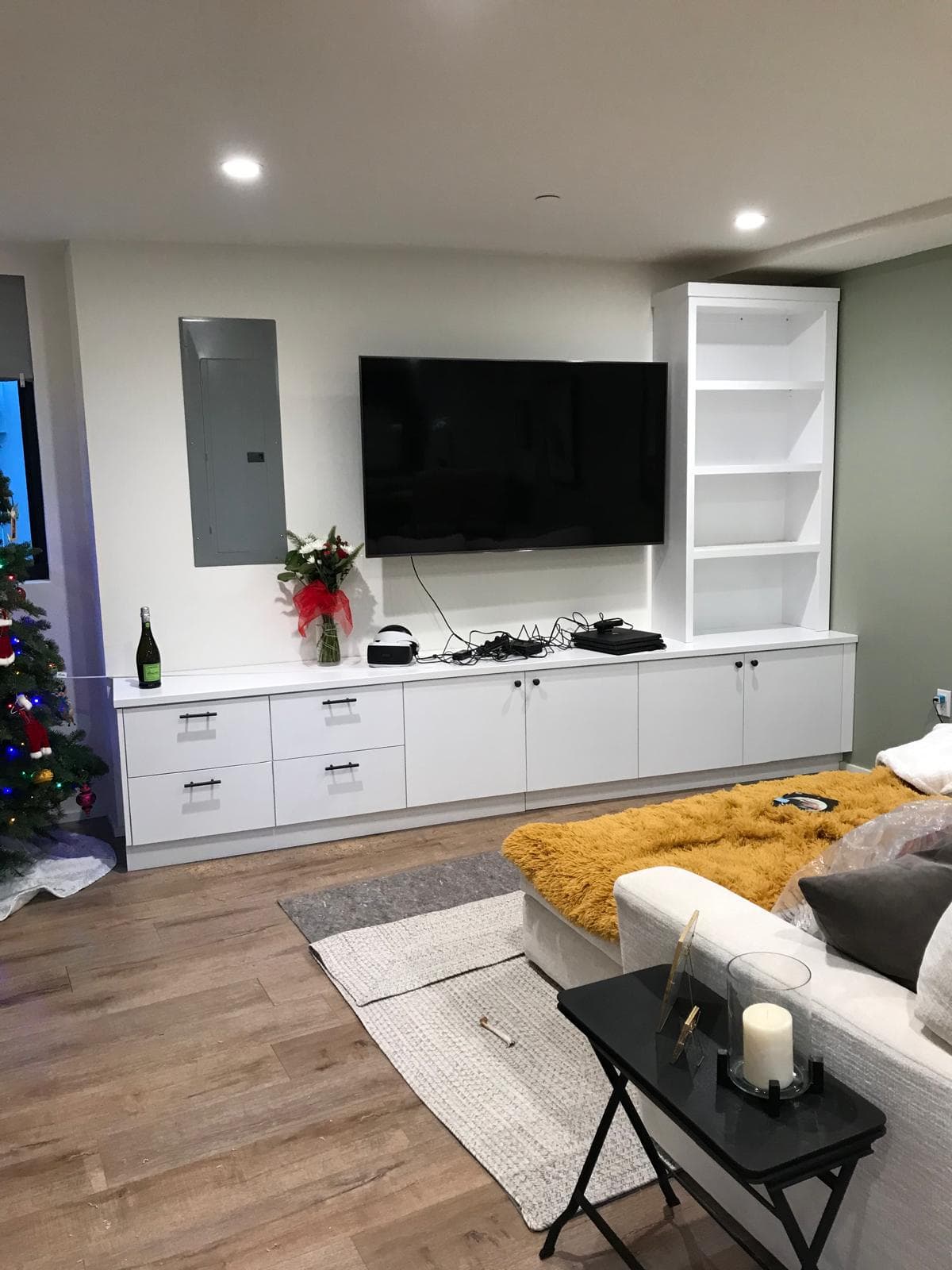 Custom built-in entertainment center with TV wall and storage